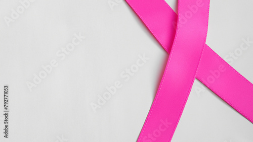 Pink ribbon on light gray. Breast Cancer Background Concept © Fuji
