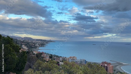 Malaga city from viewpoint Costa del Sol Spain cloudy day Alboran Sea photo
