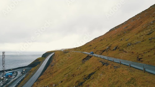 Car Journey Escapade: Cinematic Aerial Views Trailing the Scenic Routes of the Faroe Islands. photo