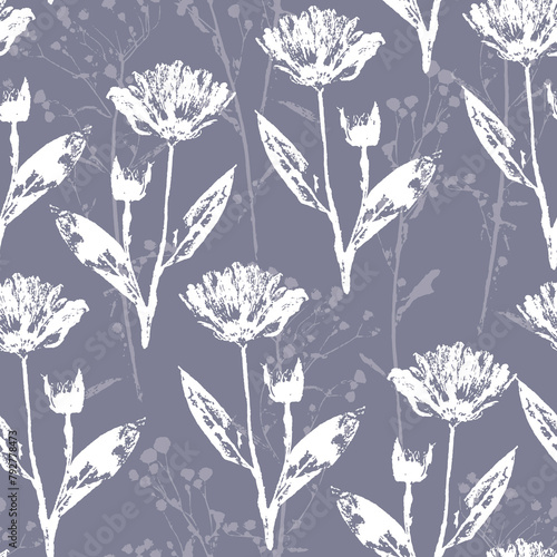 A delicate seamless pattern with white and gray silhouettes of field grasses and flowers. For fabric, textile, wrapping paper, cover.
