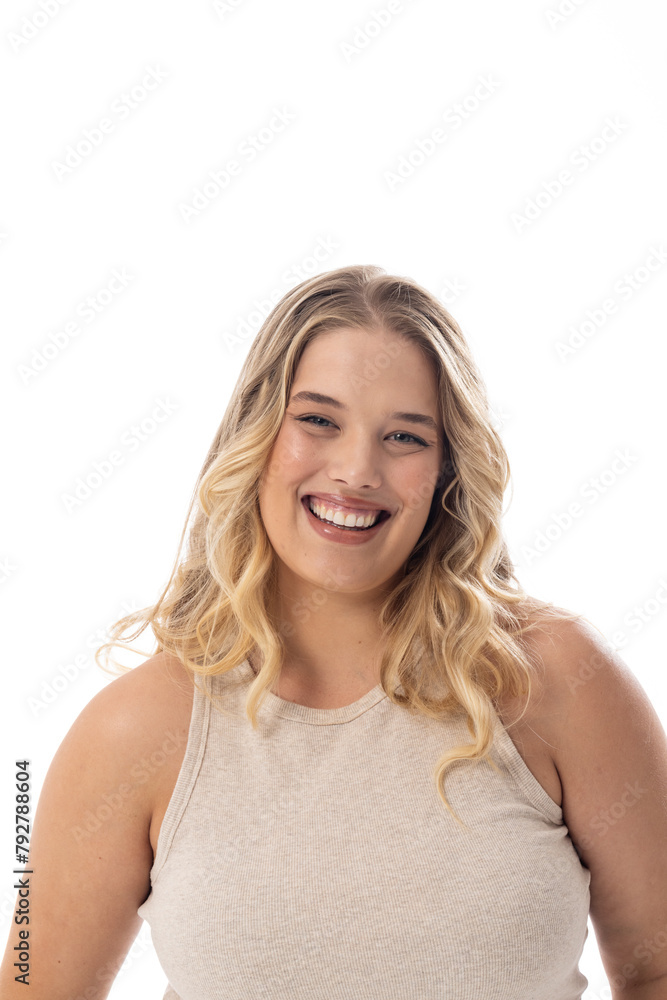 Smiling Caucasian plus size model in sleeveless top on white, copy space Smiling Caucasian plus size model in sleeveless top on white, copy space