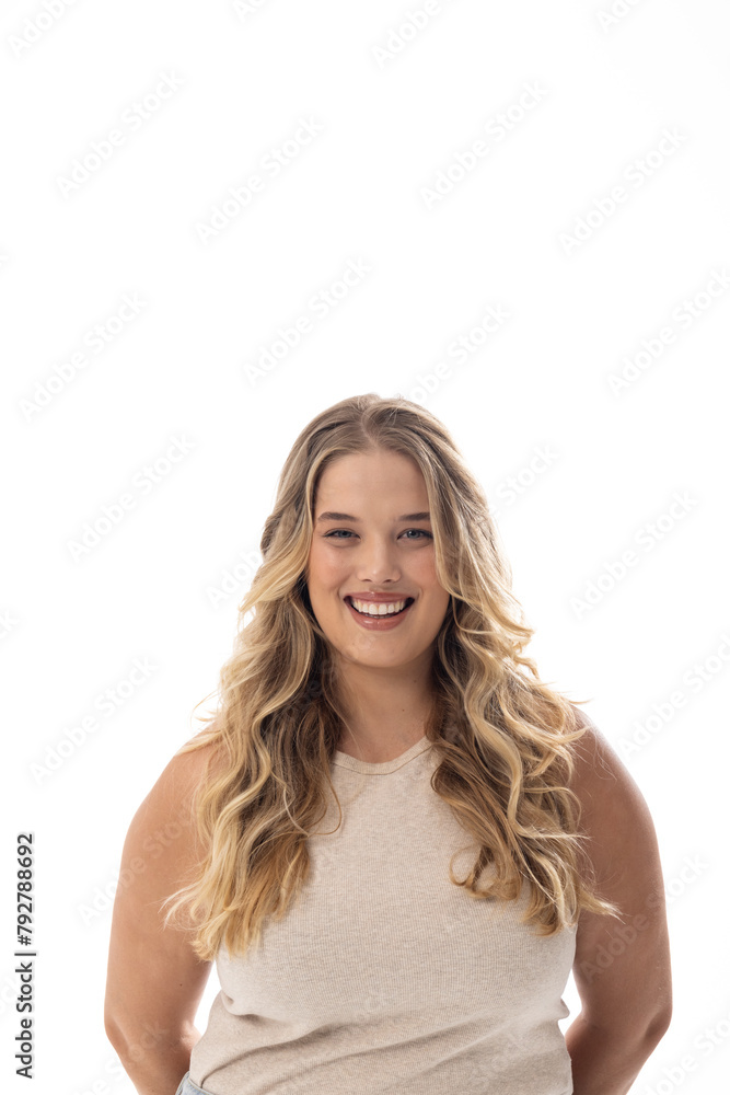 A plus size model stands on white background, smiling warmly, copy space A plus size model stands on white background, smiling warmly, copy space
