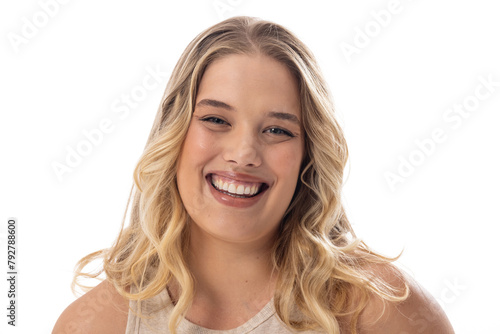 Smiling young plus-size Caucasian female model, with subtle makeup on a white background