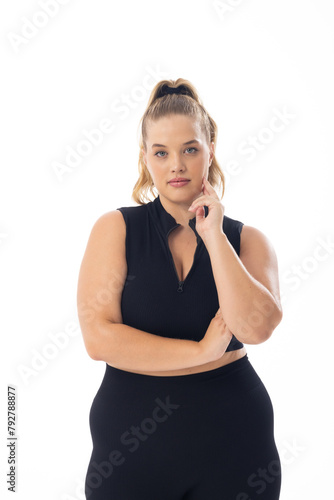 A young Caucasian plus-size model with blonde hair on white background, copy space