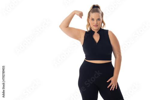 Caucasian plus size young female model flexing arm on white, showing strength