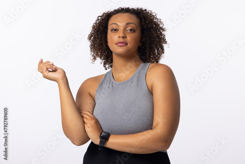Biracial young female model poses on white background