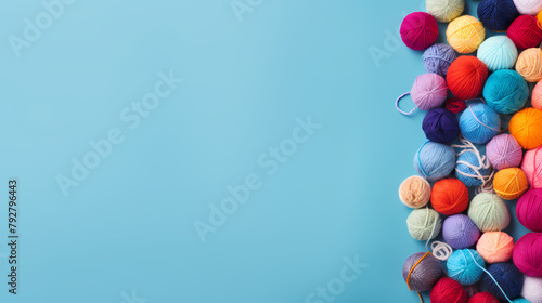 Colorful yarn balls on blue background
