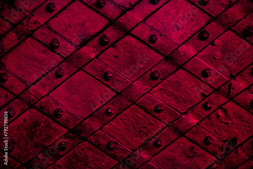 Closeup of red forged metal door