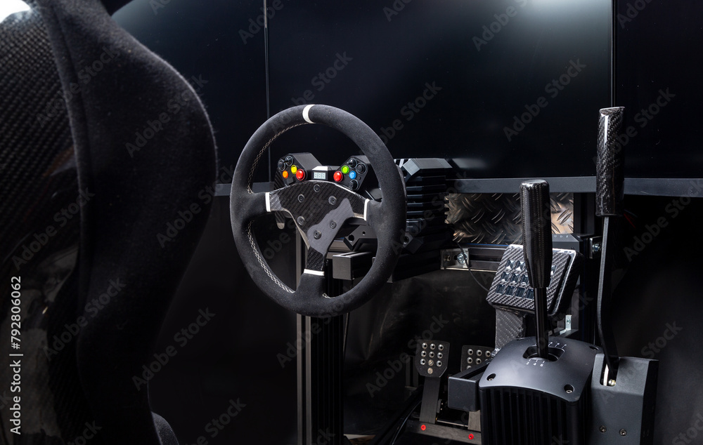 DIY high end simracing aluminum carbon fiber simulator rig for video game sim racing. Black CFK car bucket seat steering wheel shifter pedals and tripe screen setup dark background - obrazy, fototapety, plakaty 