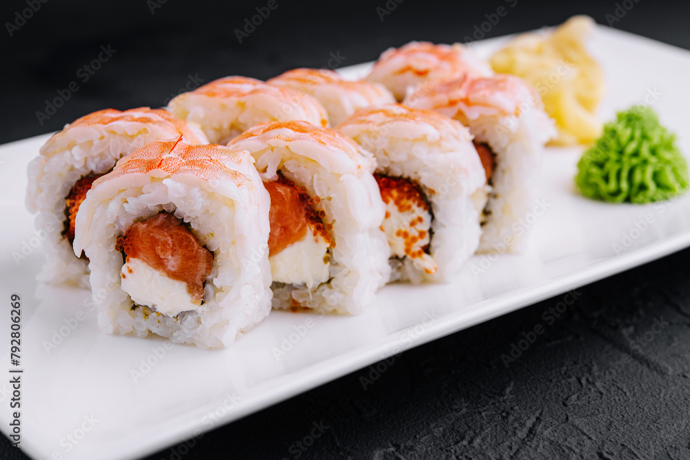 Delicious shrimp sushi roll on white plate Delicious shrimp sushi roll on white plate