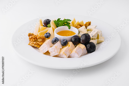 Gourmet cheese platter with honey and fruits