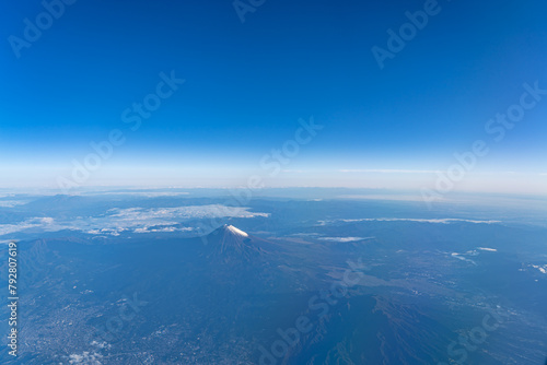 A birds eye view close-up the Mount Fuji ( Mt. Fuji ) and blue sky. Scenery landscapes of the Fuji-Hakone-Izu National Park. Shizuoka Prefecture, Japan