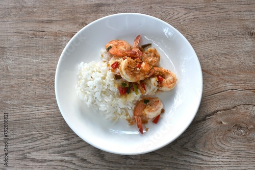 fried shrimp garlic and chili with plain rice on plate