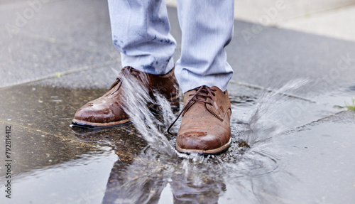 Φωτογραφία Person, puddle and shoe stepping in water on ground for commute to work, job or business