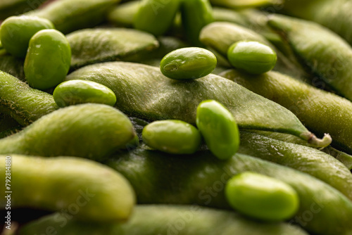 Macro close up of fresh green soy bean lying on pod edamame