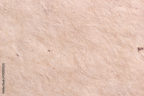 Textured beige wrinkled handmade paper background. Horizontal background for design