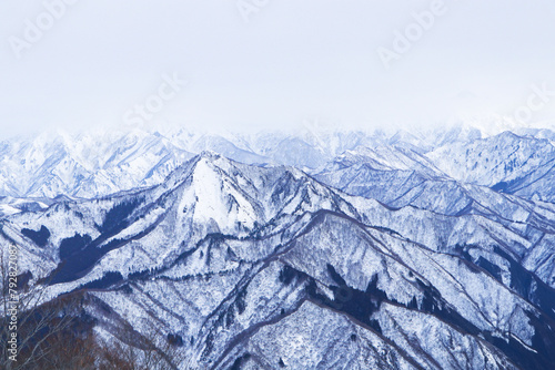 Mountain peak white snow in winter landscape in Japan. Great place for winter sports. Suitable for tourists and visiting citizens. Fog covered dark sky. Awesome Beautiful Mountain tourism vacation.