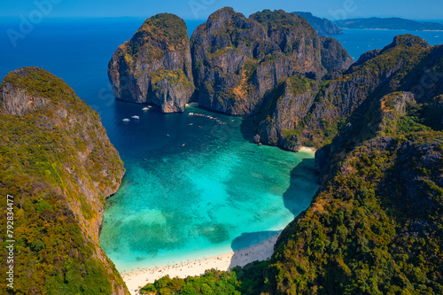 Amazing travel drone photo of landmark of Thailand island Ko Phi Phi Lee with paradise lagoon Maya Bay, white coral beach, reef with turquoise water