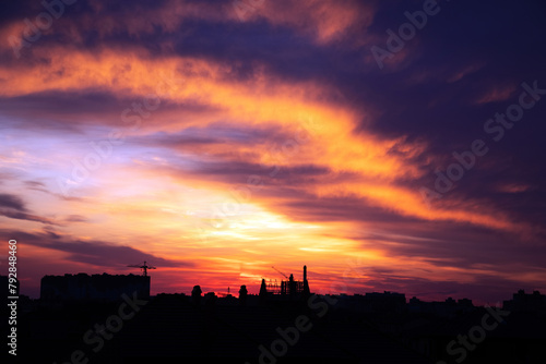 Background of a beautiful bright orange sunset with cirrus clouds