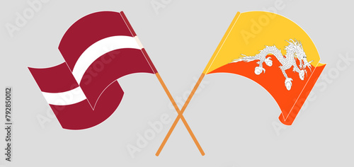 Crossed and waving flags of Latvia and Bhutan photo