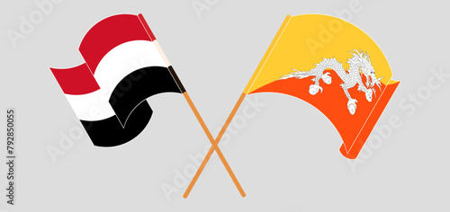 Crossed and waving flags of Yemen and Bhutan