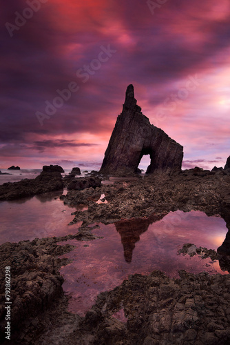 Splendid sunrise between the rocks of Campiecho beach in Asturias II