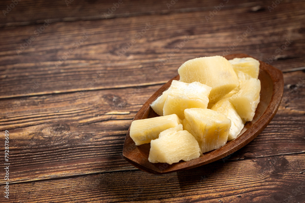 Cooked cassava served on plate on the table. Cooked cassava served on plate on the table.