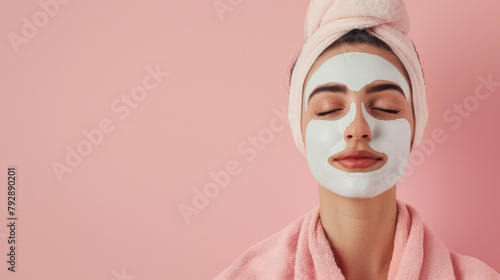 Woman calmingly rests eyes with a clay mask applied, symbolizing skincare and relaxation photo