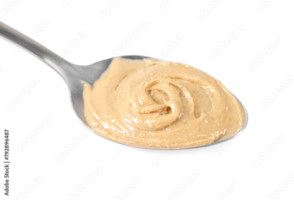Delicious nut butter in spoon isolated on white Delicious nut butter in spoon isolated on white