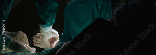 Group of team doctor and surgeon doing surgery with patient in the operation at hospital, medical and emergency, specialist and assistant rescue patient with expertise, surgical and health. photo