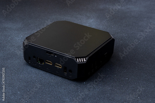 A small system unit of a personal computer. Compact black device.