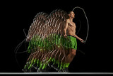 Athleticism and agility of muscular man in motion, jumping rope, showing dedication to fitness against black background with stroboscope effect. Sport, active and healthy lifestyle, endurance concept