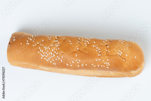 One hotdog bun with seeds