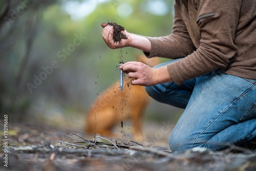 Tableau sur toile taking a soil sample for a soil test in a field