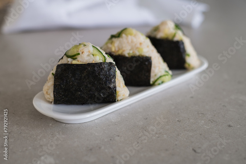 Homemade Onigiri Kyuri, rice triangle with cucumber, sesame seeds, ginger, nori seaweed (ID: 792921425)