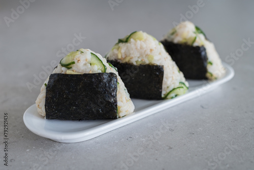 Homemade Onigiri Kyuri, rice triangle with cucumber, sesame seeds, ginger, nori seaweed (ID: 792921436)