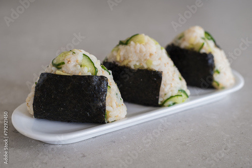 Homemade Onigiri Kyuri, rice triangle with cucumber, sesame seeds, ginger, nori seaweed (ID: 792921450)