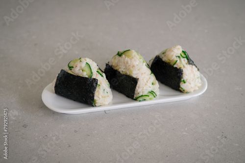 Homemade Onigiri Kyuri, rice triangle with cucumber, sesame seeds, ginger, nori seaweed (ID: 792921475)