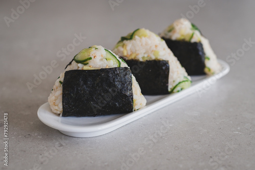 Homemade Onigiri Kyuri, rice triangle with cucumber, sesame seeds, ginger, nori seaweed (ID: 792921478)