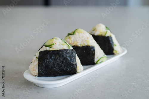 Homemade Onigiri Kyuri, rice triangle with cucumber, sesame seeds, ginger, nori seaweed (ID: 792921483)