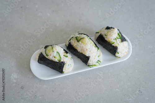 Homemade Onigiri Kyuri, rice triangle with cucumber, sesame seeds, ginger, nori seaweed (ID: 792921497)