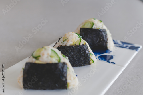 Homemade Onigiri Kyuri, rice triangle with cucumber, sesame seeds, ginger, nori seaweed (ID: 792921651)