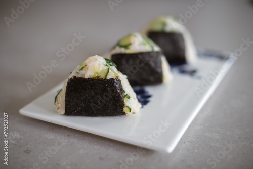 Homemade Onigiri Kyuri, rice triangle with cucumber, sesame seeds, ginger, nori seaweed (ID: 792921827)
