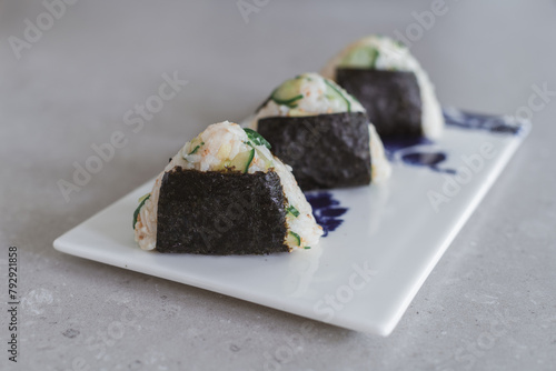 Homemade Onigiri Kyuri, rice triangle with cucumber, sesame seeds, ginger, nori seaweed (ID: 792921858)