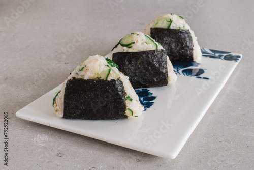 Homemade Onigiri Kyuri, rice triangle with cucumber, sesame seeds, ginger, nori seaweed (ID: 792922065)