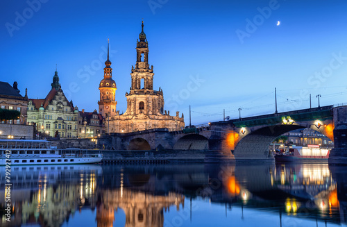 Dresden at dusk reflected in water of Elbe. Cathedral of the Holy Trinity