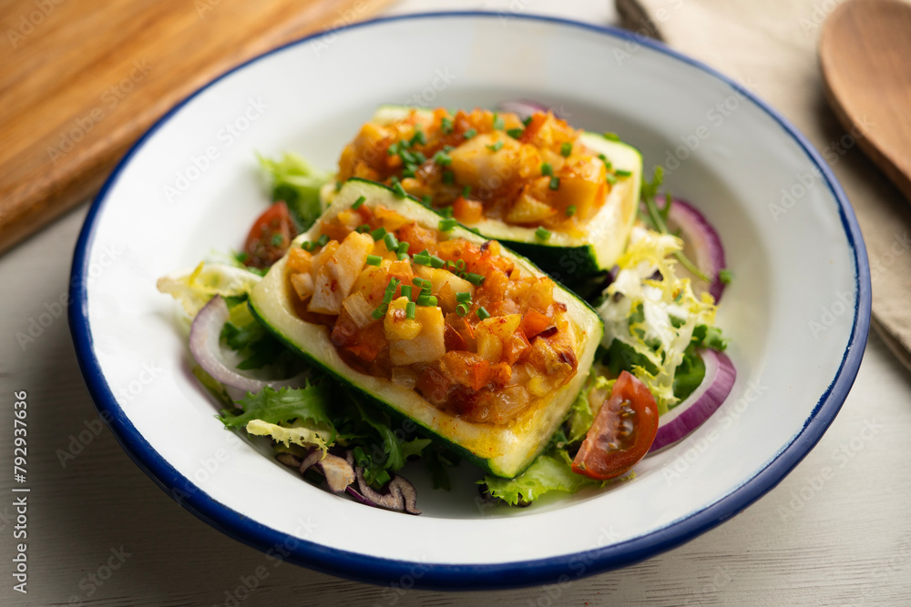 Zucchini stuffed with vegetables and fresh hake. Zucchini stuffed with vegetables and fresh hake.