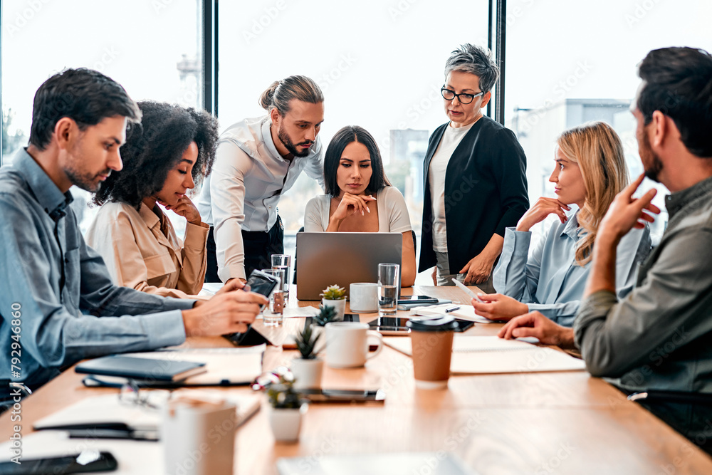 A team of business people working in a modern office. Discussion of work issues. Copy space. A team of business people working in a modern office. Discussion of work issues. Copy space.