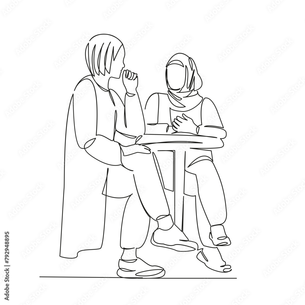 Muslim girl and European girl in a cafe Muslim girl and European girl in a cafe