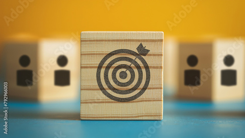 Business concept. Company achieving customer target. Arrow showing sales target. Company that determines its customer base. Target symbol written on wooden cube. photo